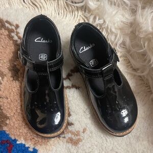 Clarks black patent leather Mary Janes. Velcro closure size 11M. Holiday shoes